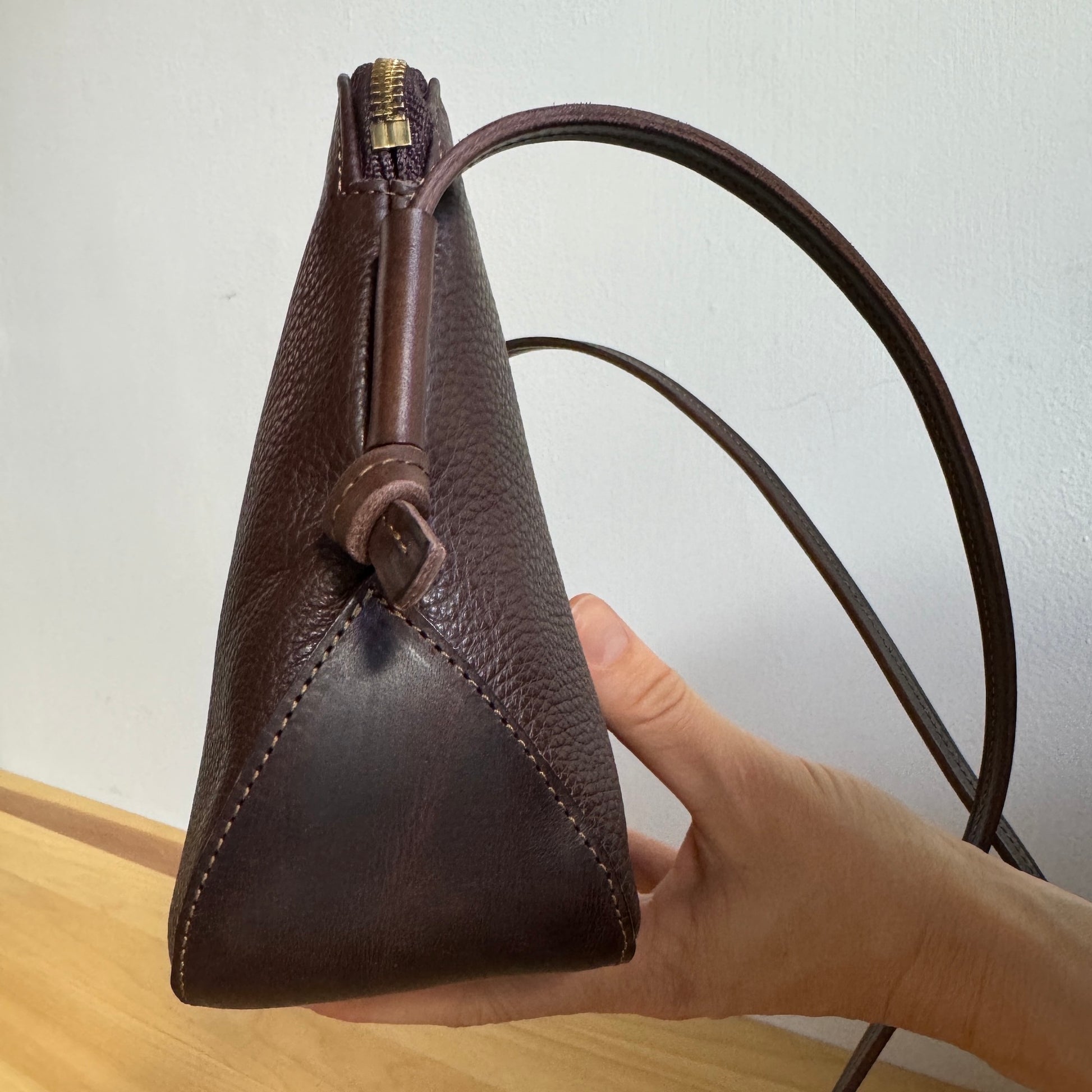 dark chocolate leather love bag side view
