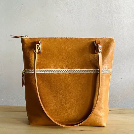 tan leather shoulder bag by Suzanne Faris