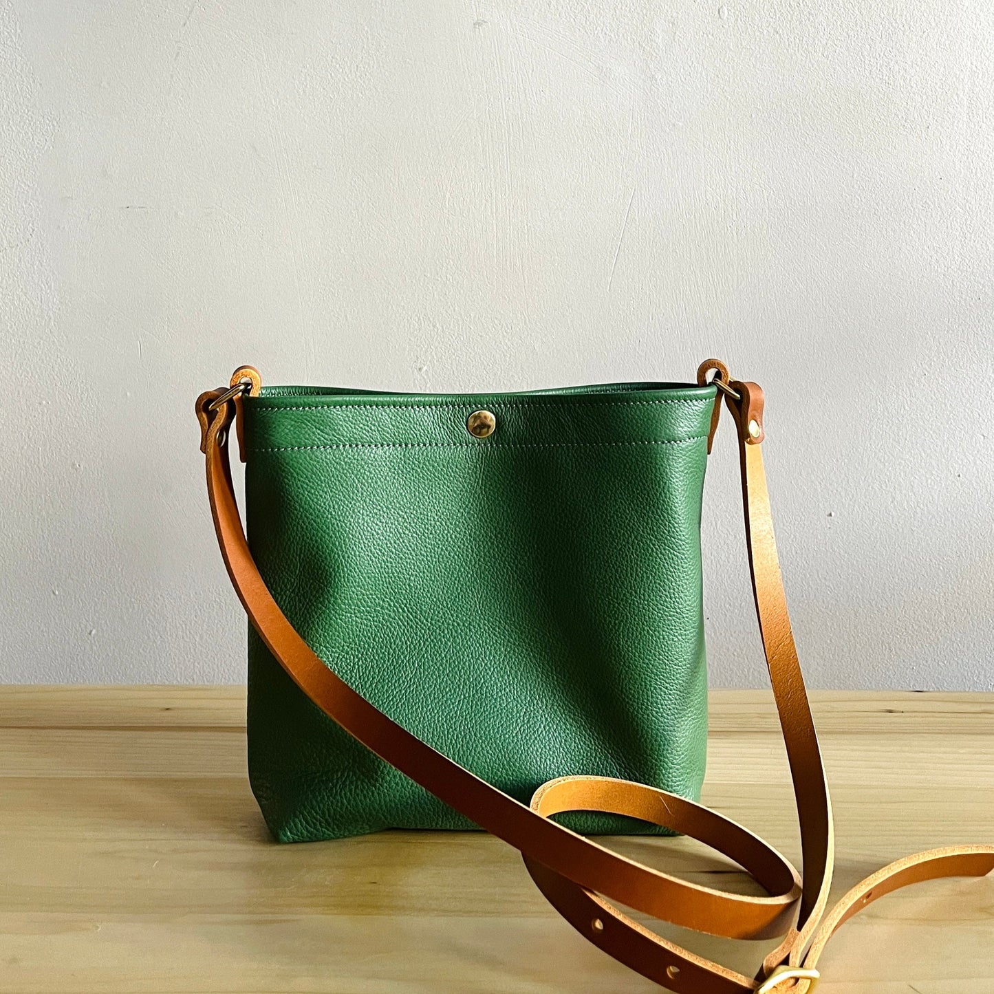 moss green leather snap bag with crossbody