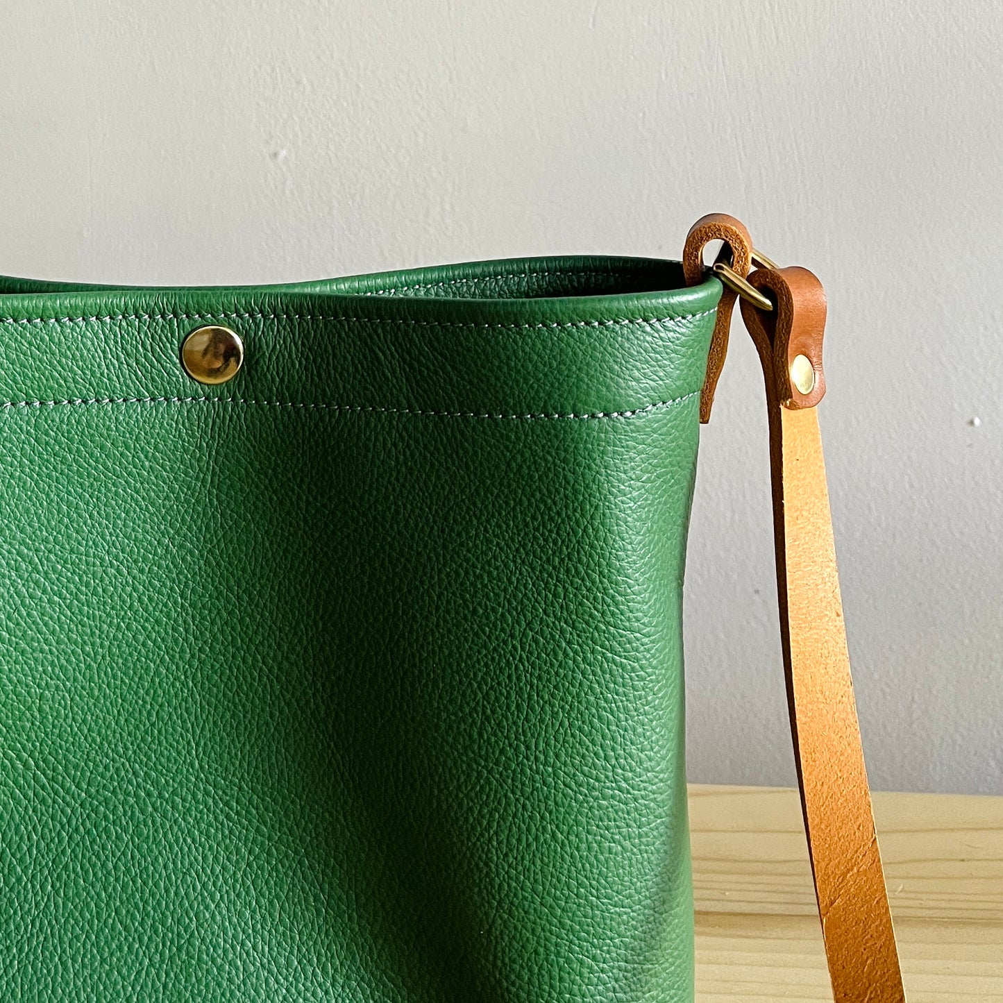 moss green leather crossbody bag with snap