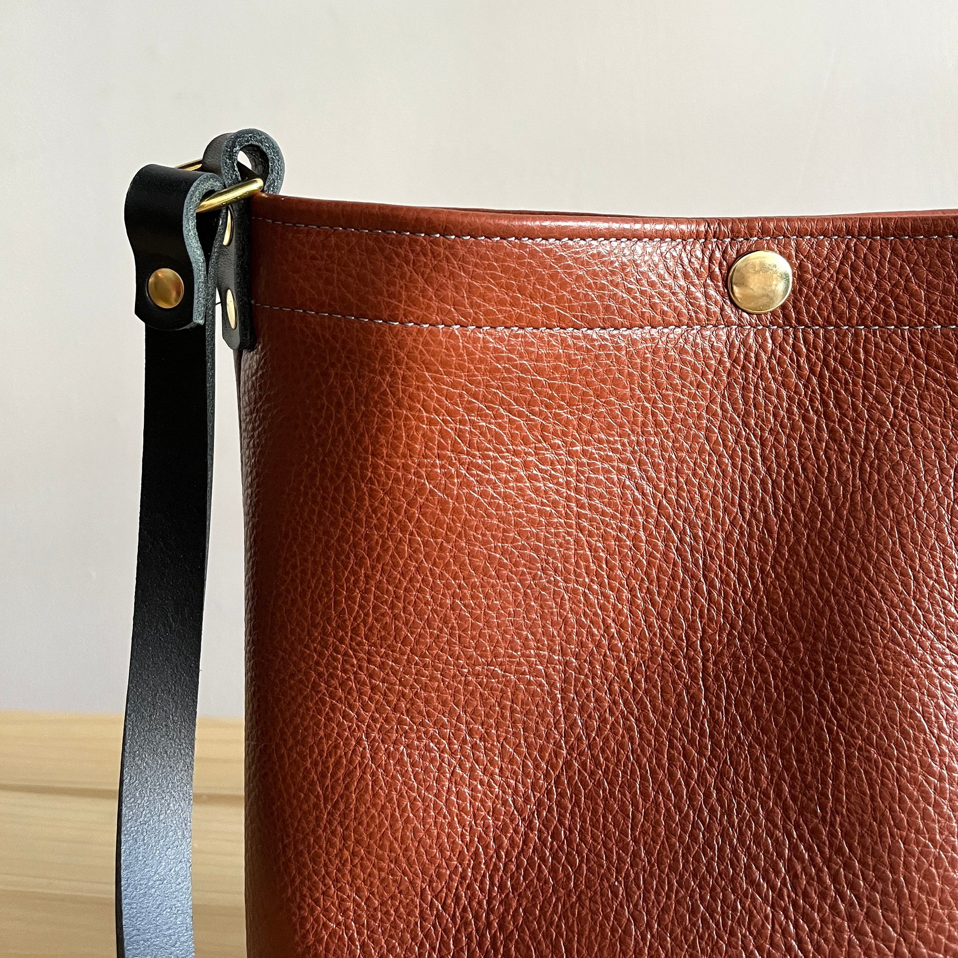 Closeup of Cognac Leather crossbody bag