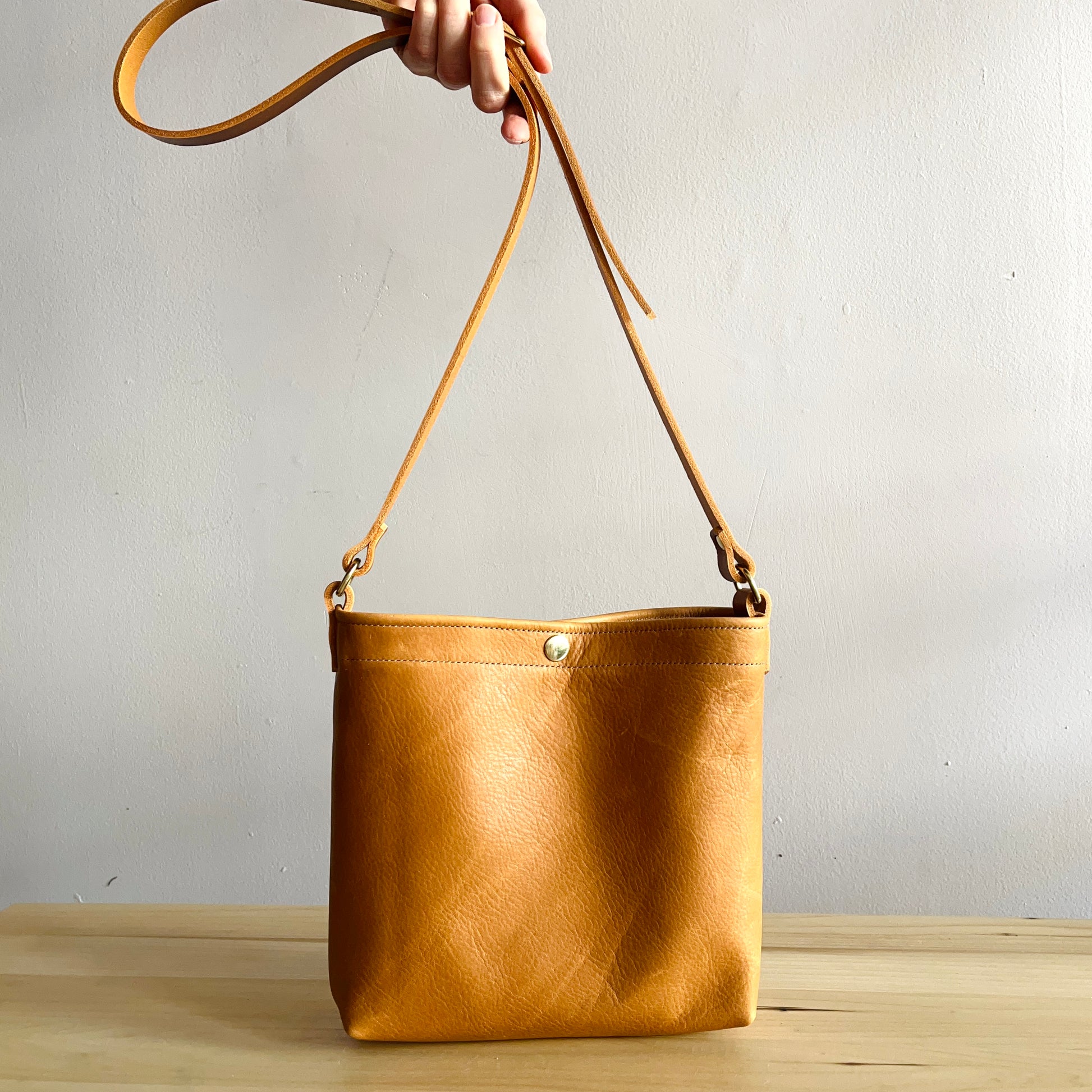 Tan leather crossbody bag