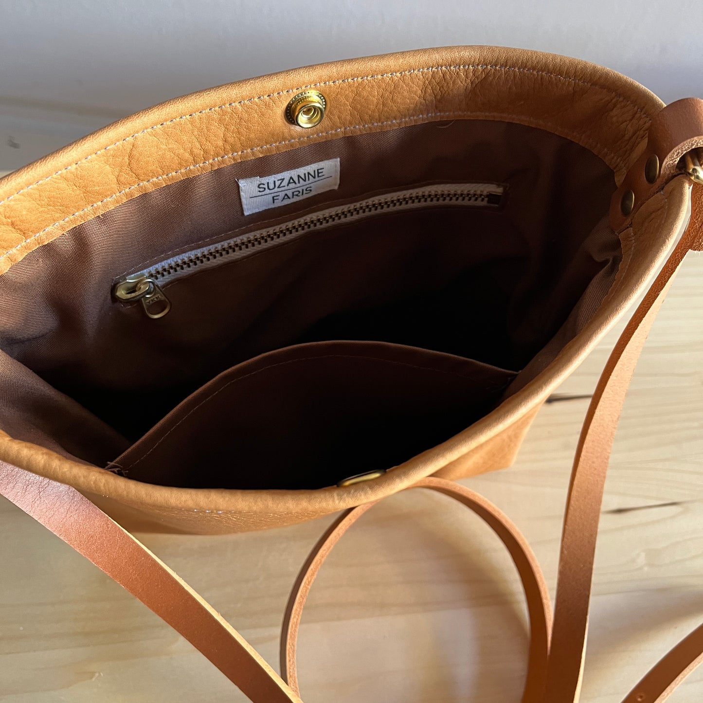 Brown interior on tan leather bag